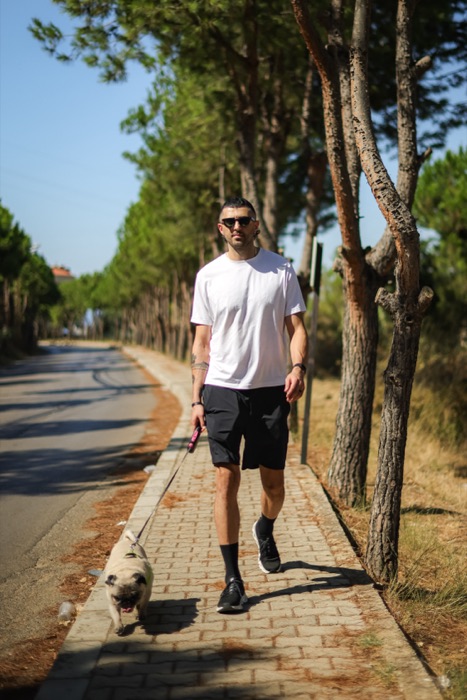 Lifestyle portrait walking beside trees